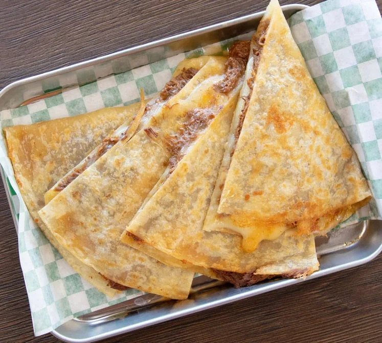 Folded quesadillas with melted cheese